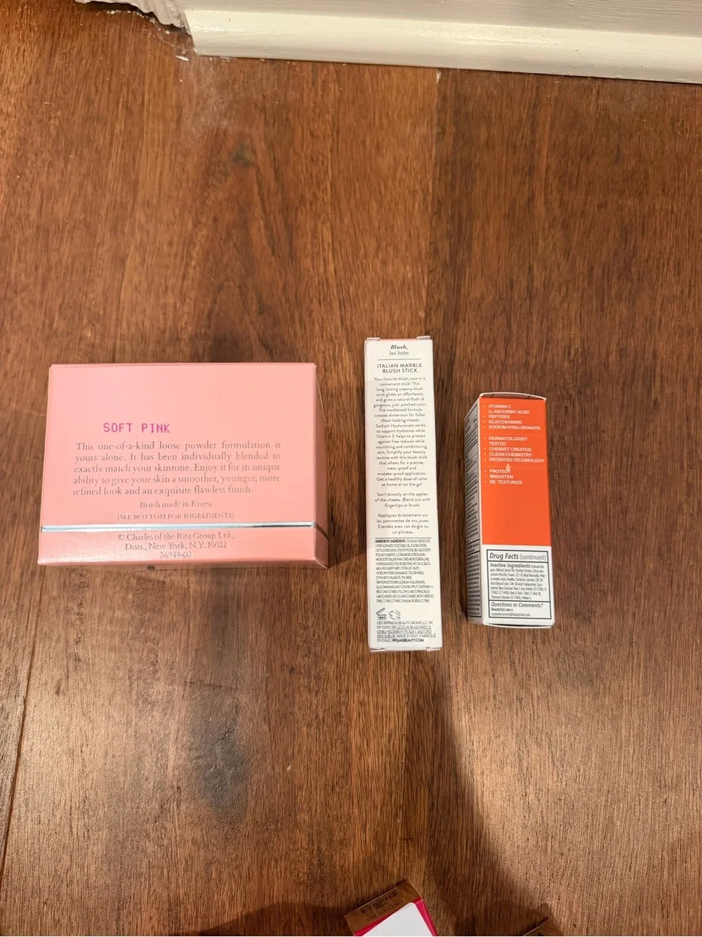 Laura Geller Pink Blush Stick & Lip Serum and charles of the ritz powder